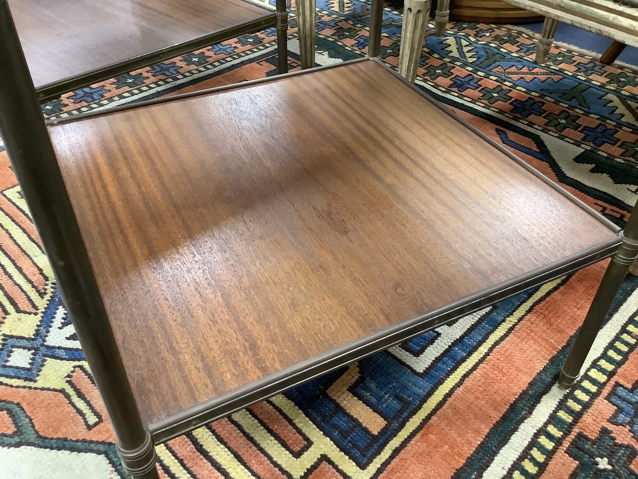 A pair of brass and teak two tier occasional tables, width 44cm depth 44cm height 58cm